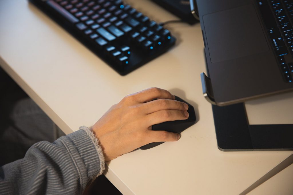 crop person with computer mouse