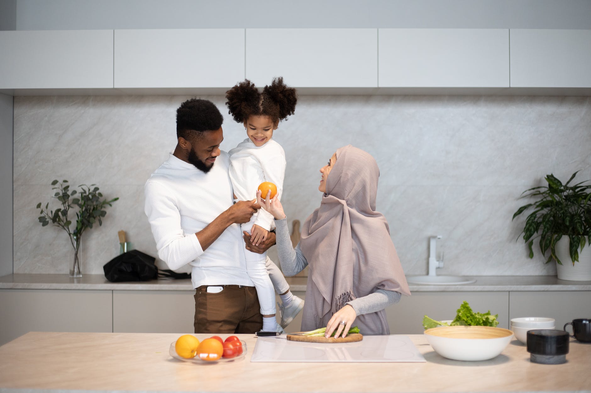 content diverse family together in kitchen